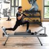Extra Large Pilates Reformer - Multi-functional Home Fitness Equipment, 395lbs Capacity, with Dynamic Resistance Cords and Aerobic Rebounder